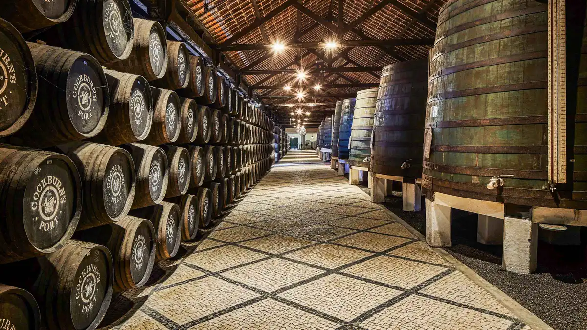 Oak barrels in the Cockburn's lodge on a port wine cellar tour in Vila Nova de Gaia, Porto, Portugal