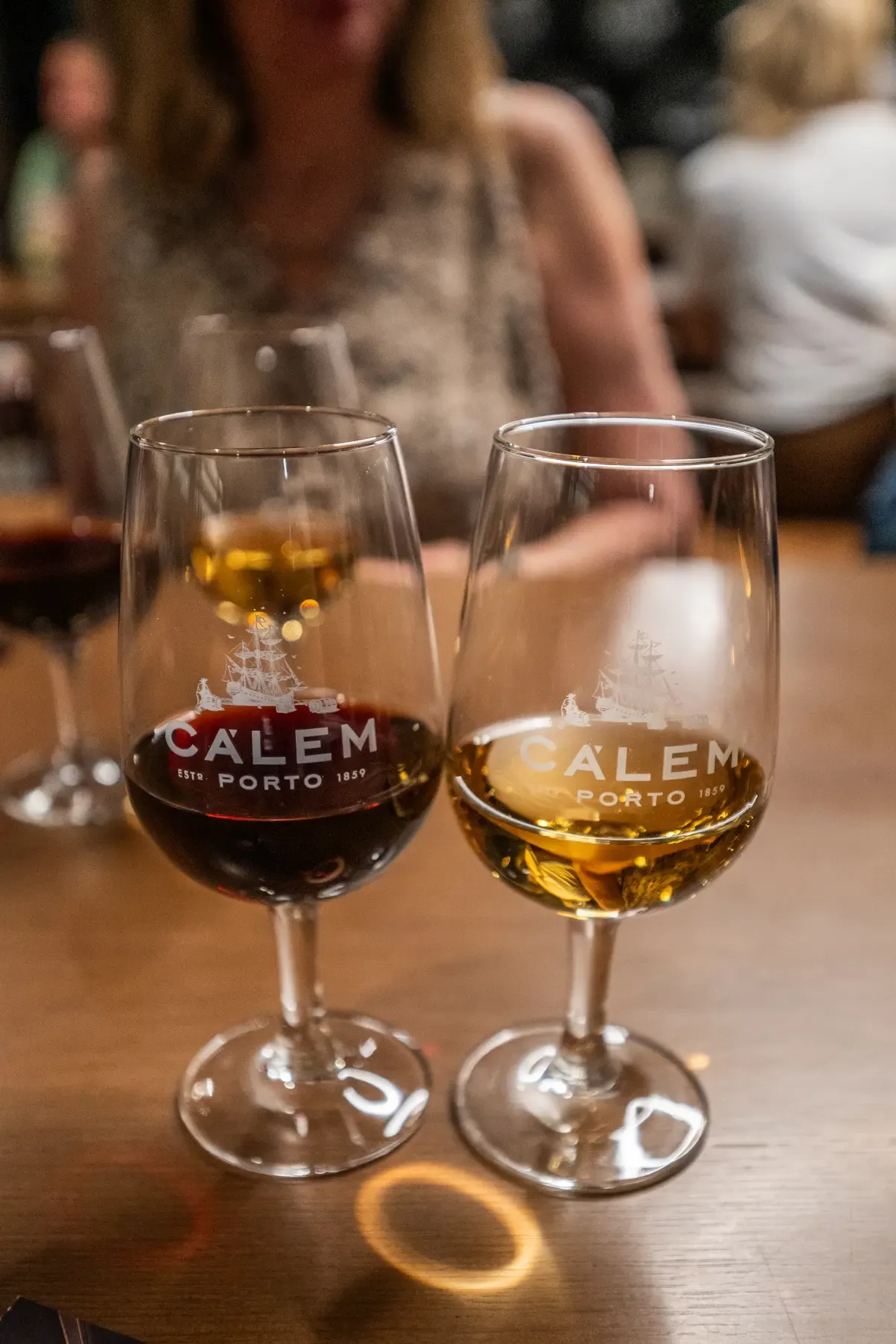 Two glasses of port, a ruby and a tawny, at the end of a Cálem cellar visit, seen on Porto wine cellar tours