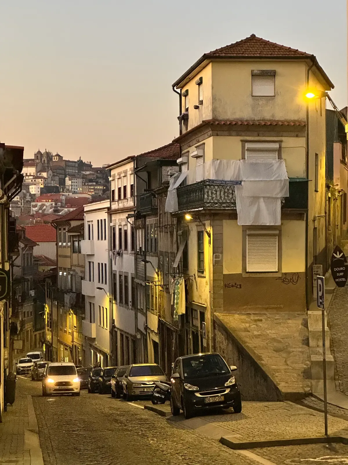 A street climbing the hill in Vila Nova de Gaia at dusk, seen on a port wine cellar tour in Vila Nova de Gaia